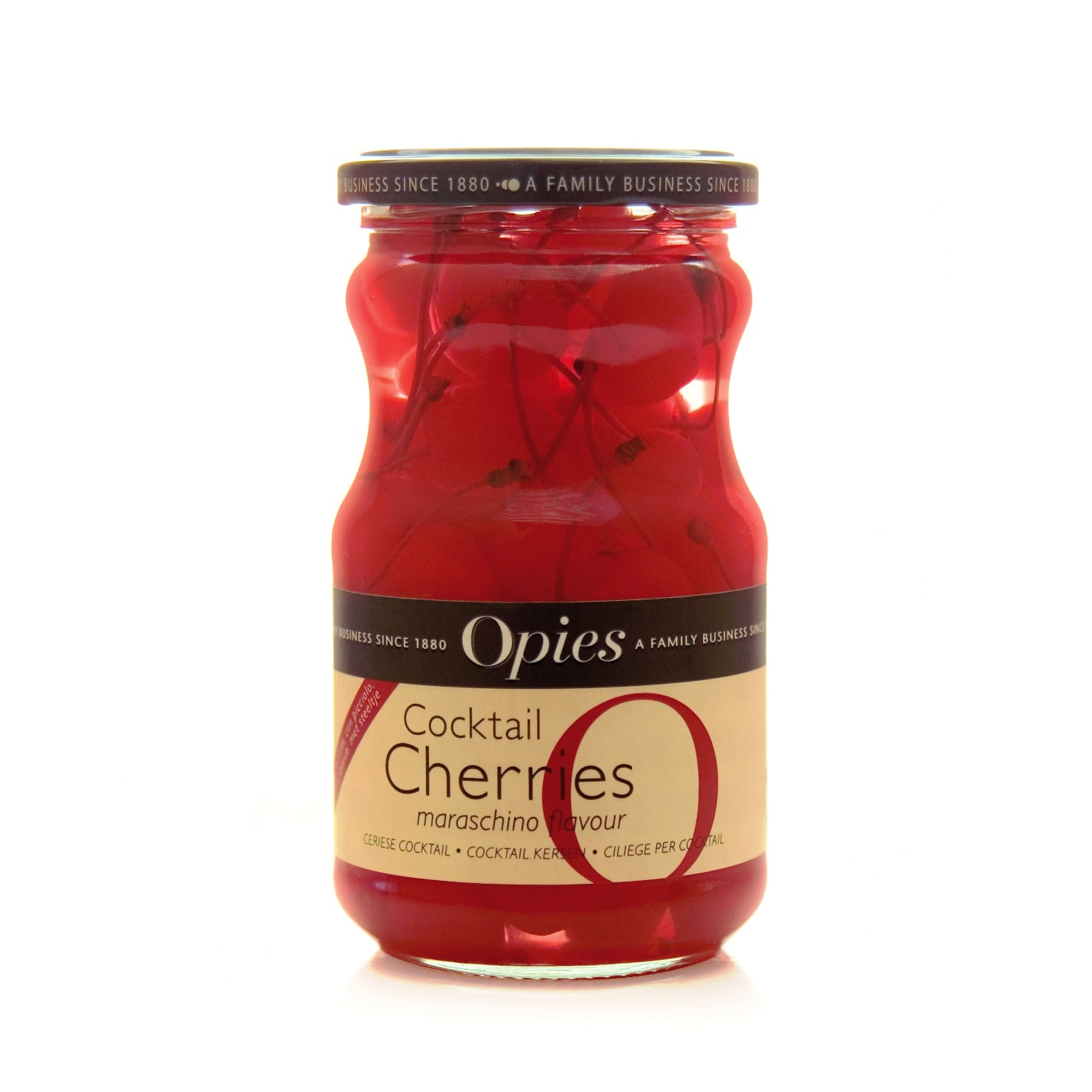 A jar of Opies cocktail cherries with stems, 500g size, showing red cherries inside the jar.