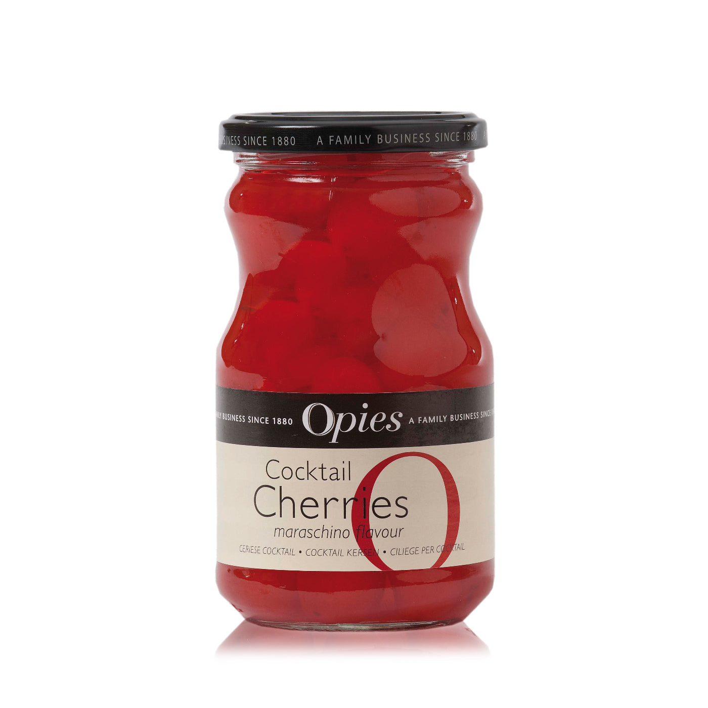A jar of Opies Cocktail Cherries, showing bright red cherries in a clear glass container with a black lid.
